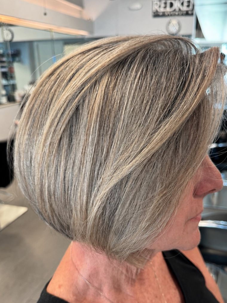 Women's cut and style at Hair by Heidi